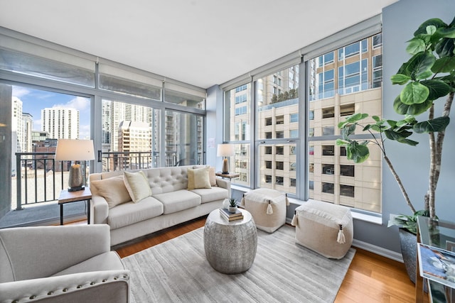 sunroom / solarium featuring a city view and a healthy amount of sunlight