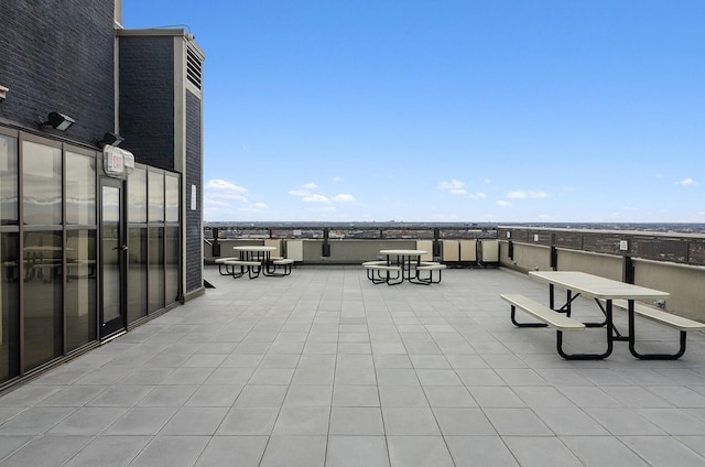 view of patio featuring a balcony