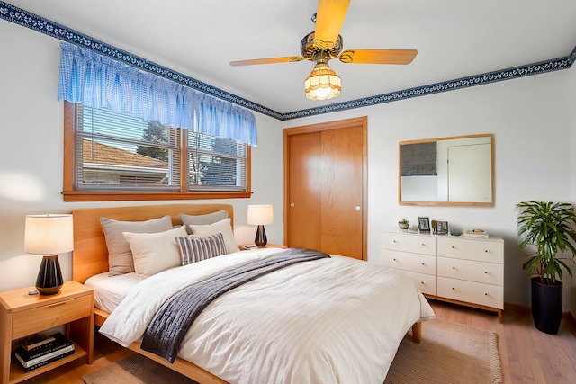bedroom featuring wood finished floors and a closet