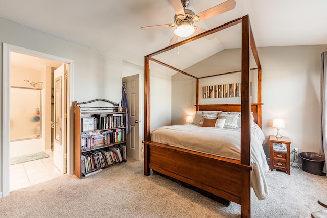 carpeted bedroom featuring connected bathroom, a ceiling fan, and vaulted ceiling