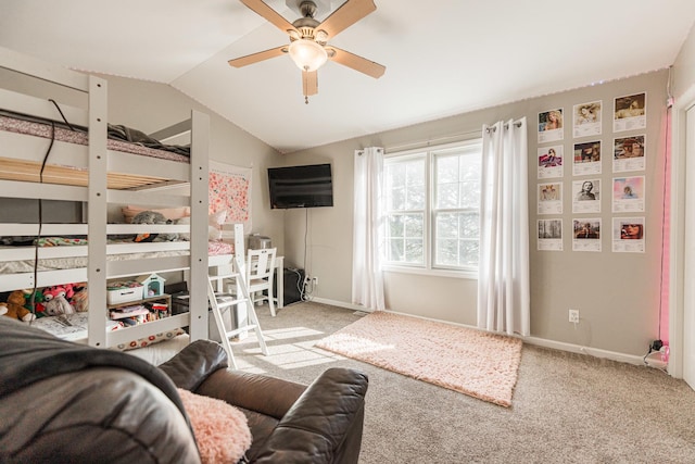 carpeted bedroom with baseboards, lofted ceiling, and ceiling fan