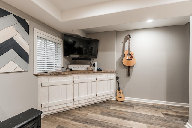 kitchen with baseboards and wood finished floors