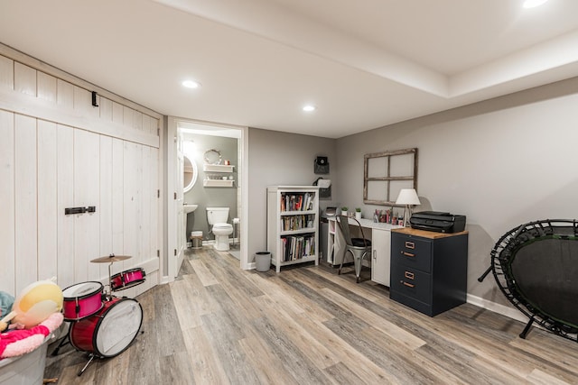 office space featuring recessed lighting, light wood-type flooring, and baseboards