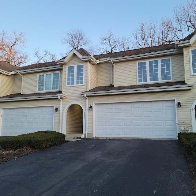 view of front of property with a garage and driveway