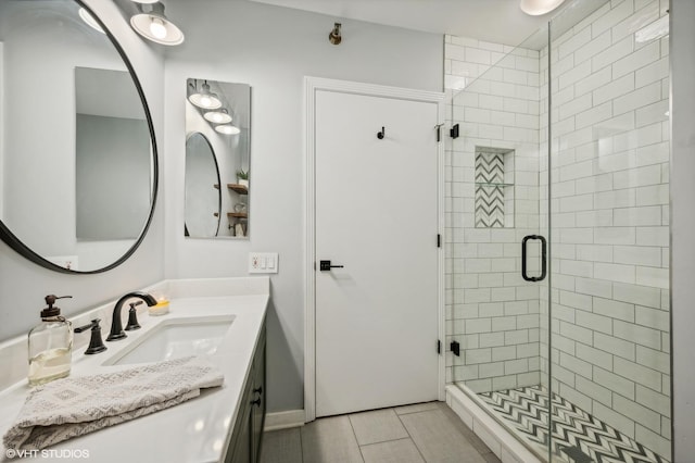 bathroom with vanity and a stall shower