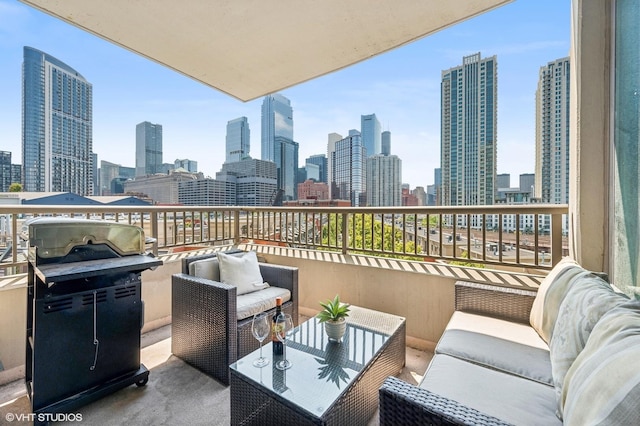 view of patio with a view of city, a balcony, area for grilling, and outdoor lounge area