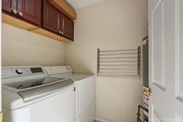 laundry room featuring cabinet space and separate washer and dryer