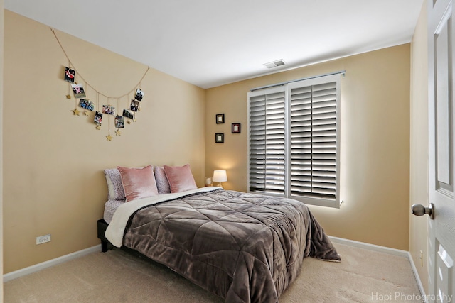 bedroom with carpet flooring and baseboards