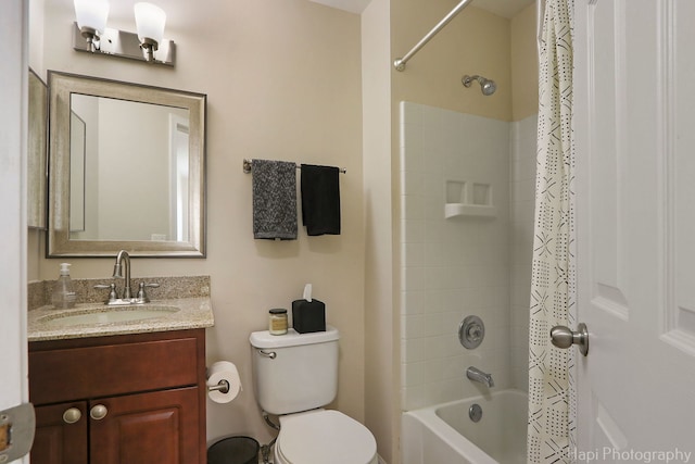 bathroom featuring shower / tub combo with curtain, toilet, and vanity