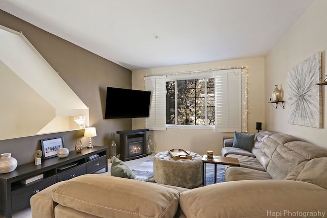 living room with a glass covered fireplace