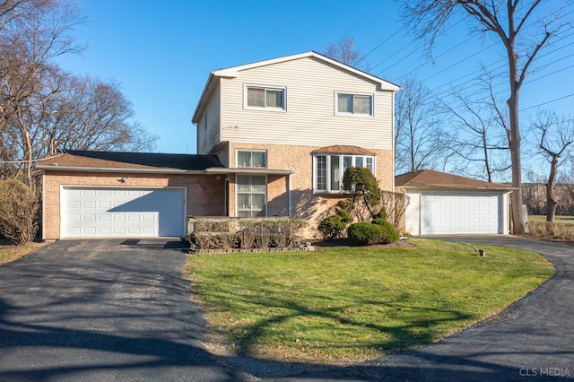 view of front facade with a front lawn, brick siding, and a garage