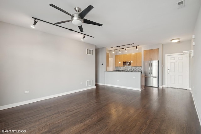 unfurnished living room with visible vents, ceiling fan, and dark wood finished floors