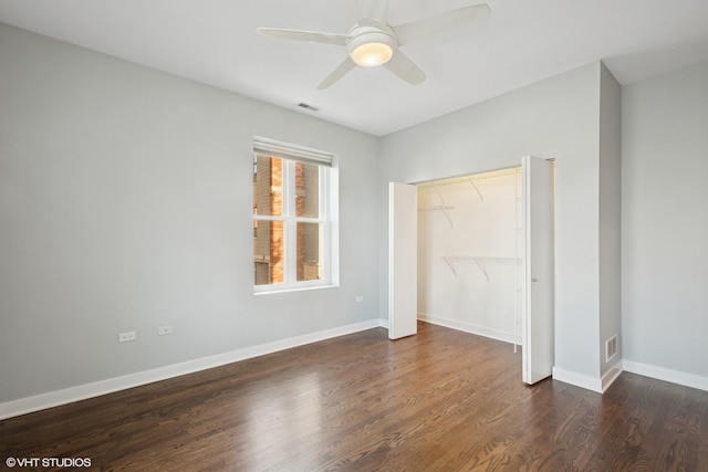 unfurnished bedroom with visible vents, ceiling fan, baseboards, wood finished floors, and a closet