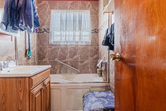 bathroom featuring vanity and bathing tub / shower combination