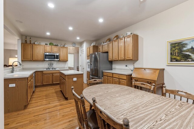 13536 Westridge Ct, Huntley, IL 60142 - kitchen with stainless steel appliances, light wood-style flooring, a sink, recessed lighting, and a kitchen island