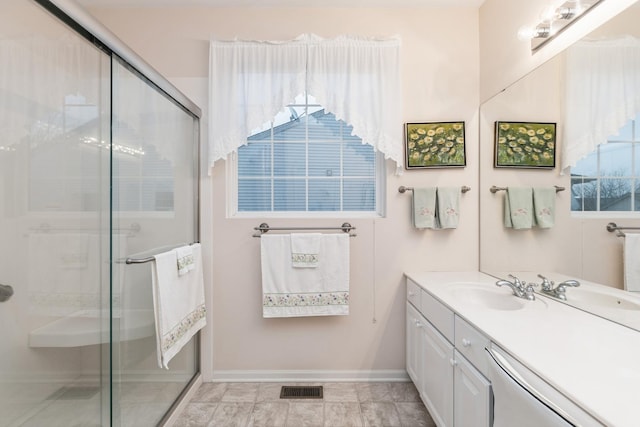 13536 Westridge Ct, Huntley, IL 60142 - full bathroom featuring visible vents, baseboards, vanity, and a stall shower