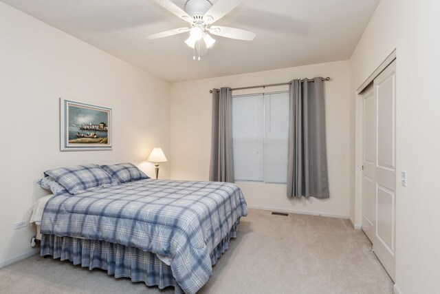 13536 Westridge Ct, Huntley, IL 60142 - bedroom with a closet, visible vents, baseboards, and light carpet