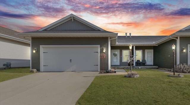 ranch-style home with concrete driveway, an attached garage, and a lawn