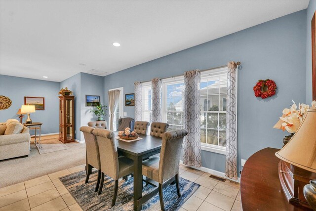 dining area featuring visible vents, light carpet, recessed lighting, light tile patterned floors, and baseboards