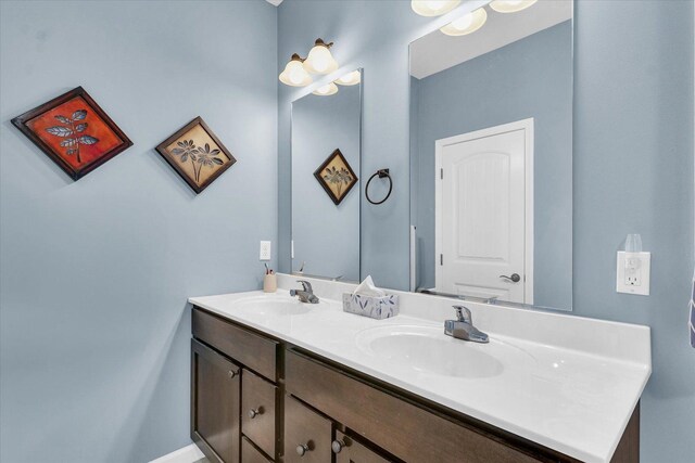 bathroom featuring double vanity and a sink