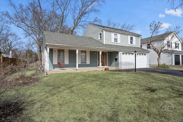 traditional home with a front lawn, driveway, a porch, an attached garage, and a shingled roof