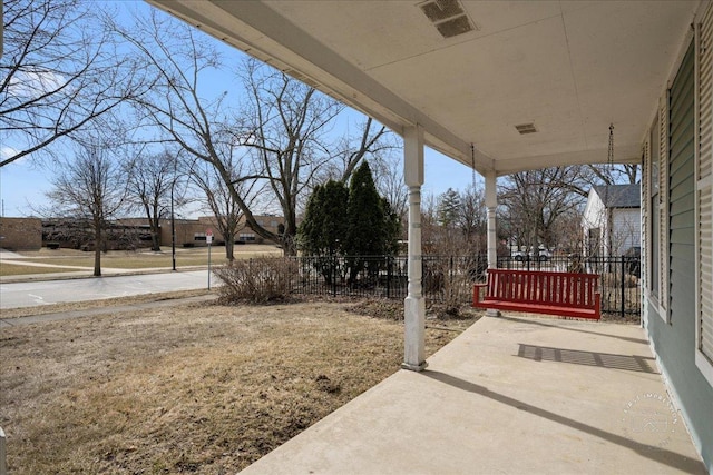 view of patio featuring fence and visible vents