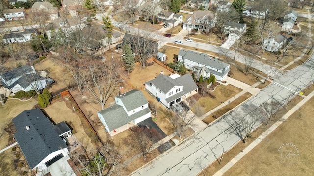 birds eye view of property with a residential view