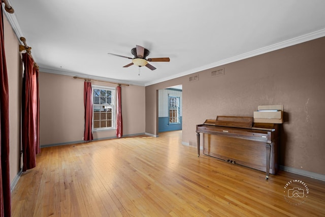 unfurnished living room with light wood-type flooring, visible vents, and ornamental molding