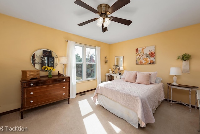 bedroom featuring visible vents, ceiling fan, baseboards, and carpet