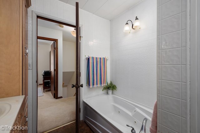 bathroom featuring vanity and a whirlpool tub