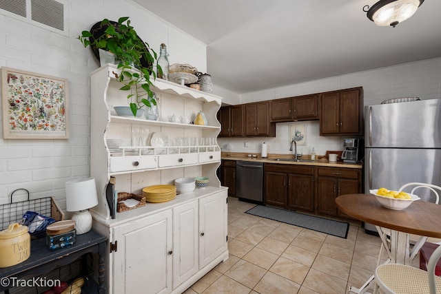 kitchen featuring visible vents, open shelves, a sink, stainless steel appliances, and light countertops