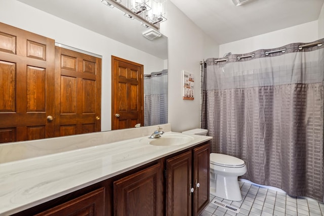 bathroom with vanity, a shower with curtain, visible vents, tile patterned floors, and toilet