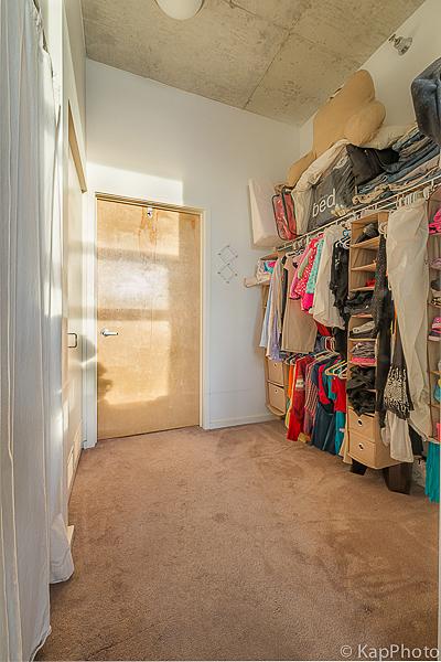 walk in closet with carpet flooring