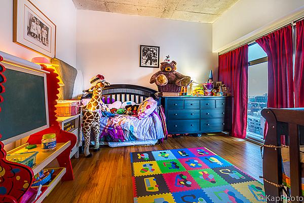 bedroom featuring wood finished floors and access to outside