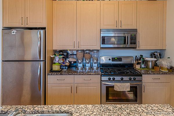 kitchen featuring stone countertops and stainless steel appliances