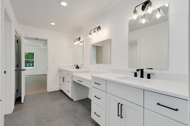 full bathroom with vanity, recessed lighting, and baseboards