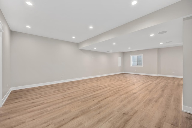 below grade area featuring recessed lighting, baseboards, and light wood finished floors