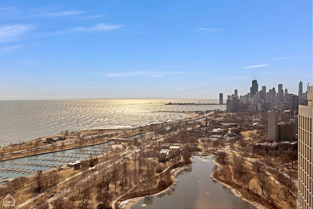 exterior space with a city view and a water view