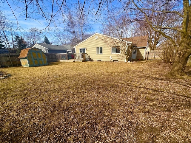 view of yard with a fenced backyard, a shed, and an outdoor structure