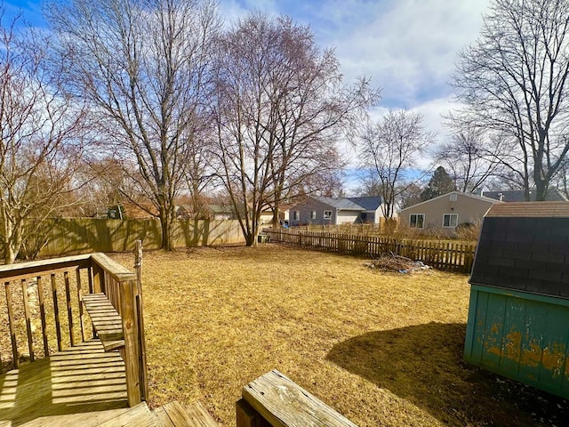 view of yard with a fenced backyard and a residential view