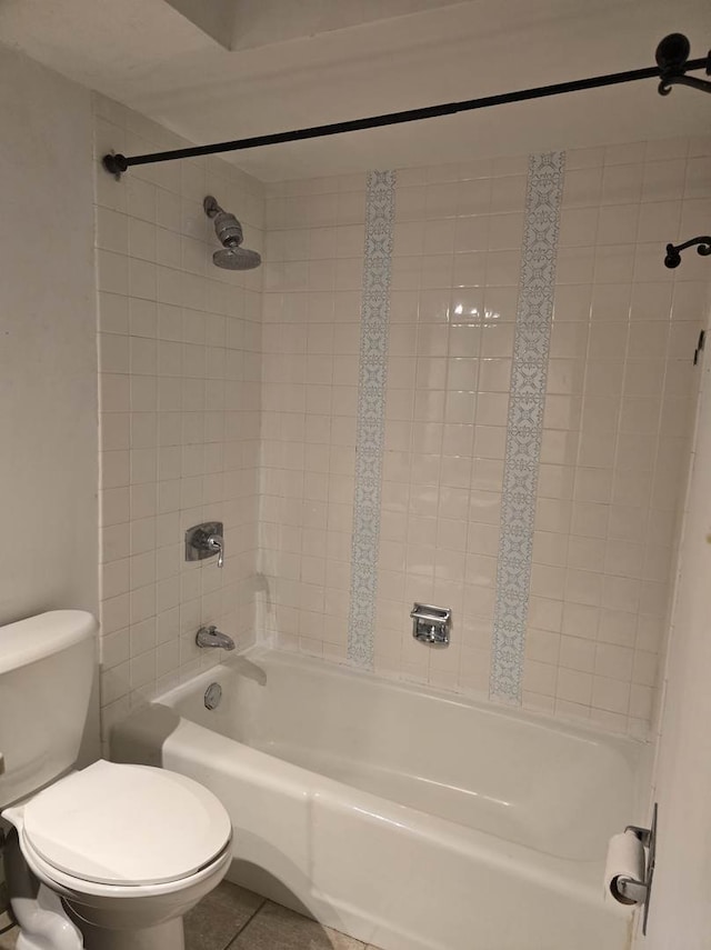 full bath with tile patterned flooring, toilet, and  shower combination