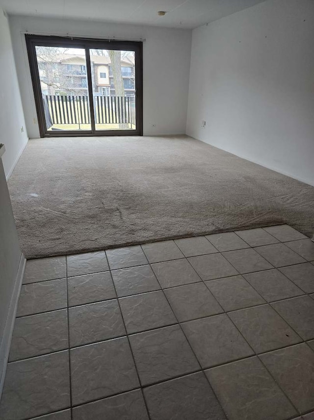 spare room featuring carpet floors