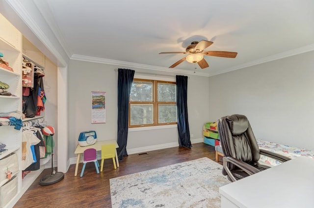 home office with ceiling fan, wood finished floors, baseboards, and ornamental molding