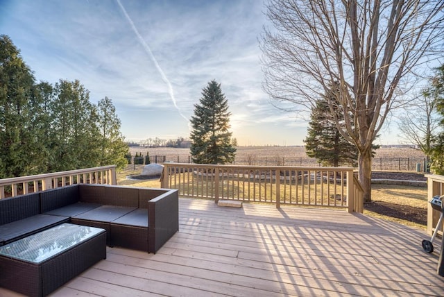 wooden deck featuring a rural view and an outdoor living space