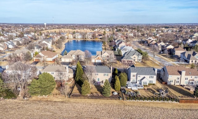 birds eye view of property with a residential view and a water view