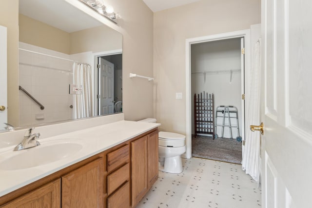 bathroom with a shower with curtain, toilet, and vanity