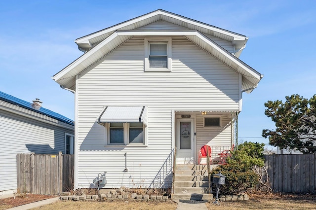 view of front of house with fence