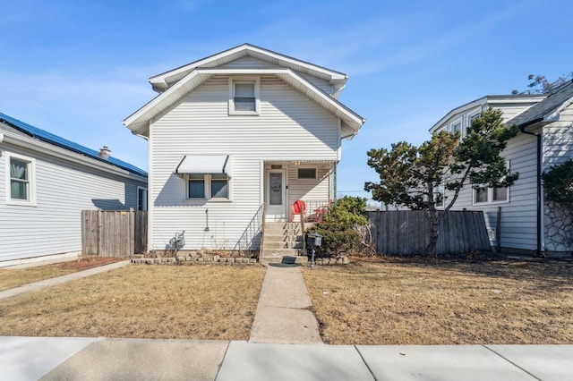 view of front of home with fence