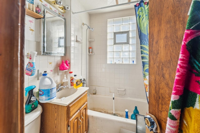 full bath with shower / bathtub combination with curtain, toilet, tile walls, decorative backsplash, and vanity