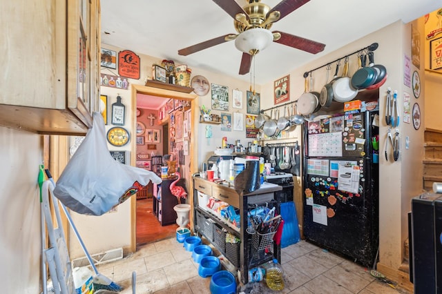 misc room featuring tile patterned floors and ceiling fan